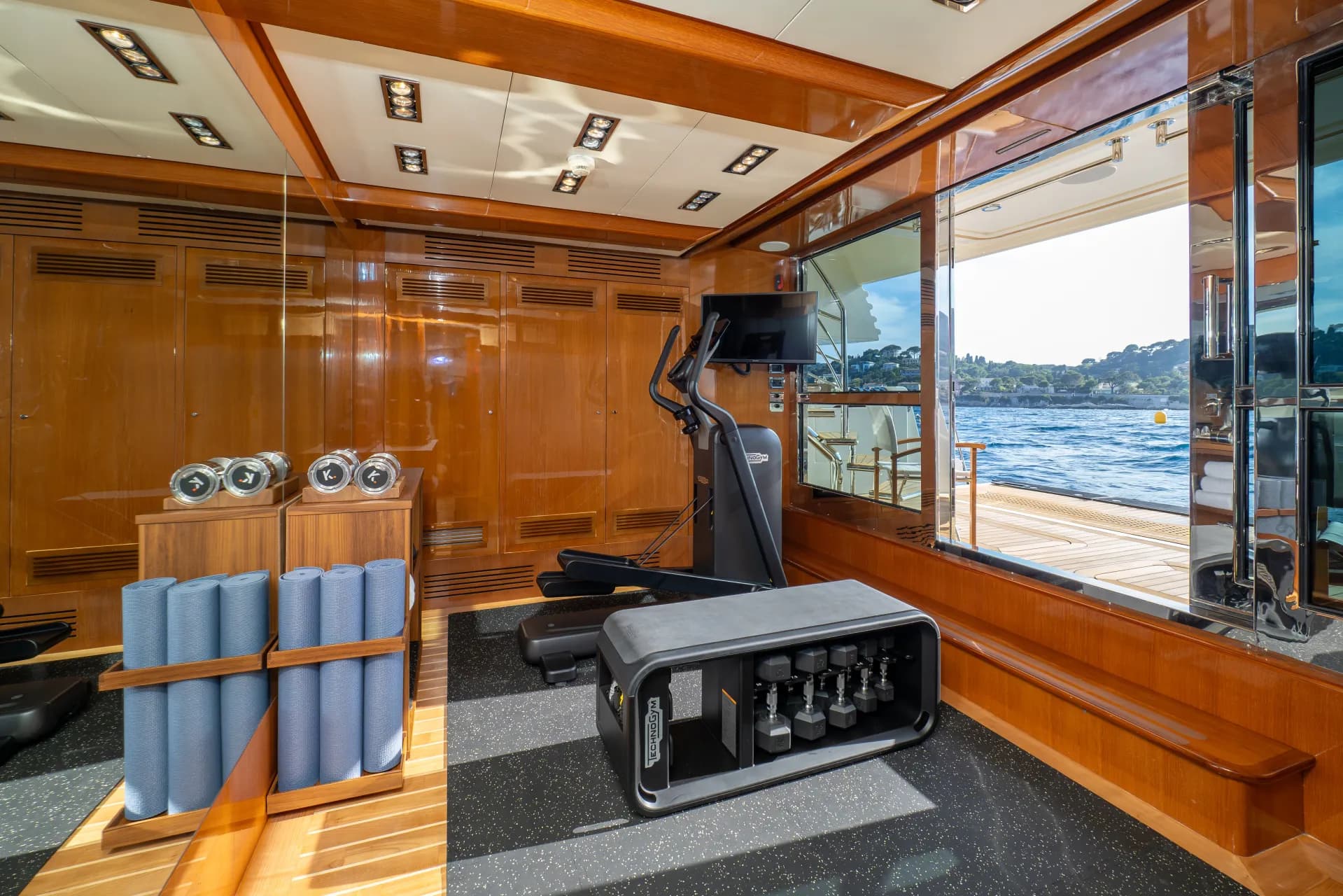 HANA's sea-level gym with a window opening onto the water